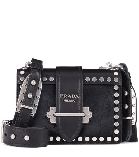 prada black leather shoulder bag.